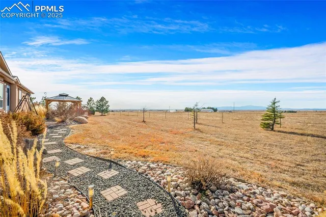 a view of a car park in front of house