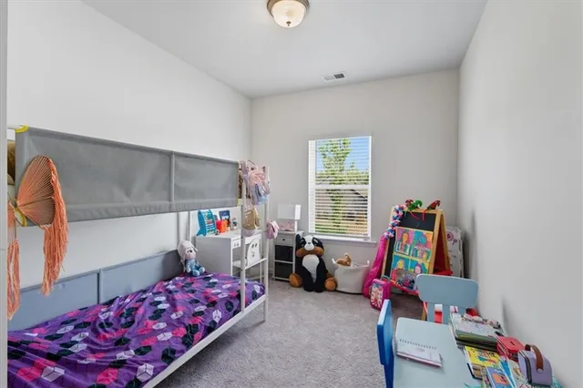 a bedroom with furniture and a window