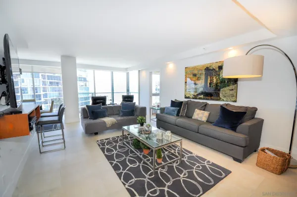a living room with furniture or couch and a large window