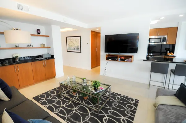 a living room with furniture and a flat screen tv