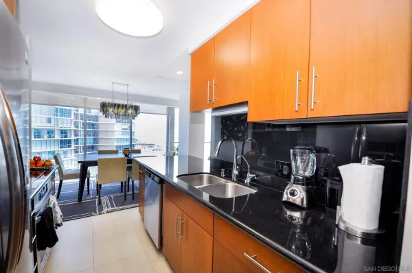 a kitchen with stainless steel appliances granite countertop a sink and cabinets