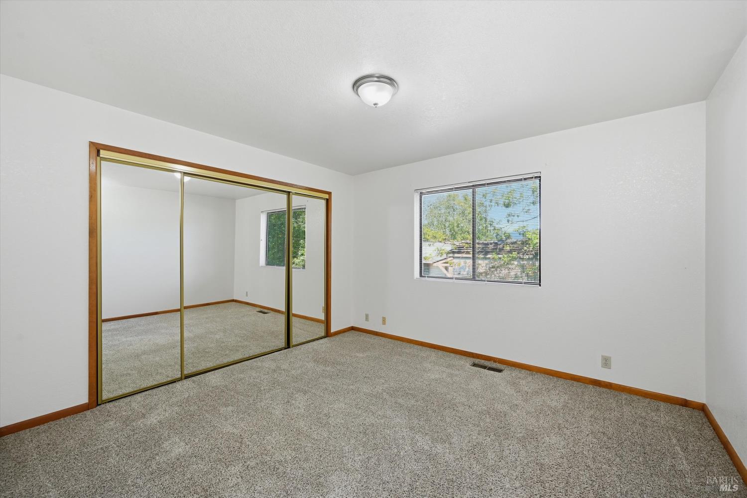 929 Helen Avenue Ukiah, CA 95482 - Photo 14 of 36 an empty room with sliding door and windows