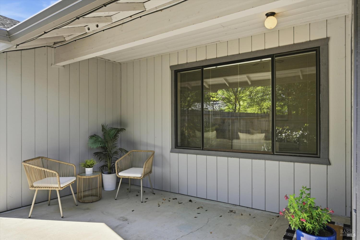 929 Helen Avenue Ukiah, CA 95482 - Photo 21 of 36 a porch with a chair and table in front of it