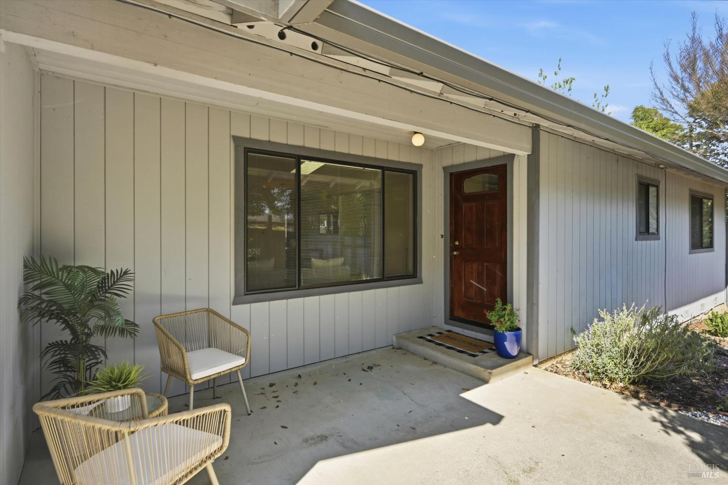 929 Helen Avenue Ukiah, CA 95482 - Photo 22 of 36 a living room with a couch and potted plant
