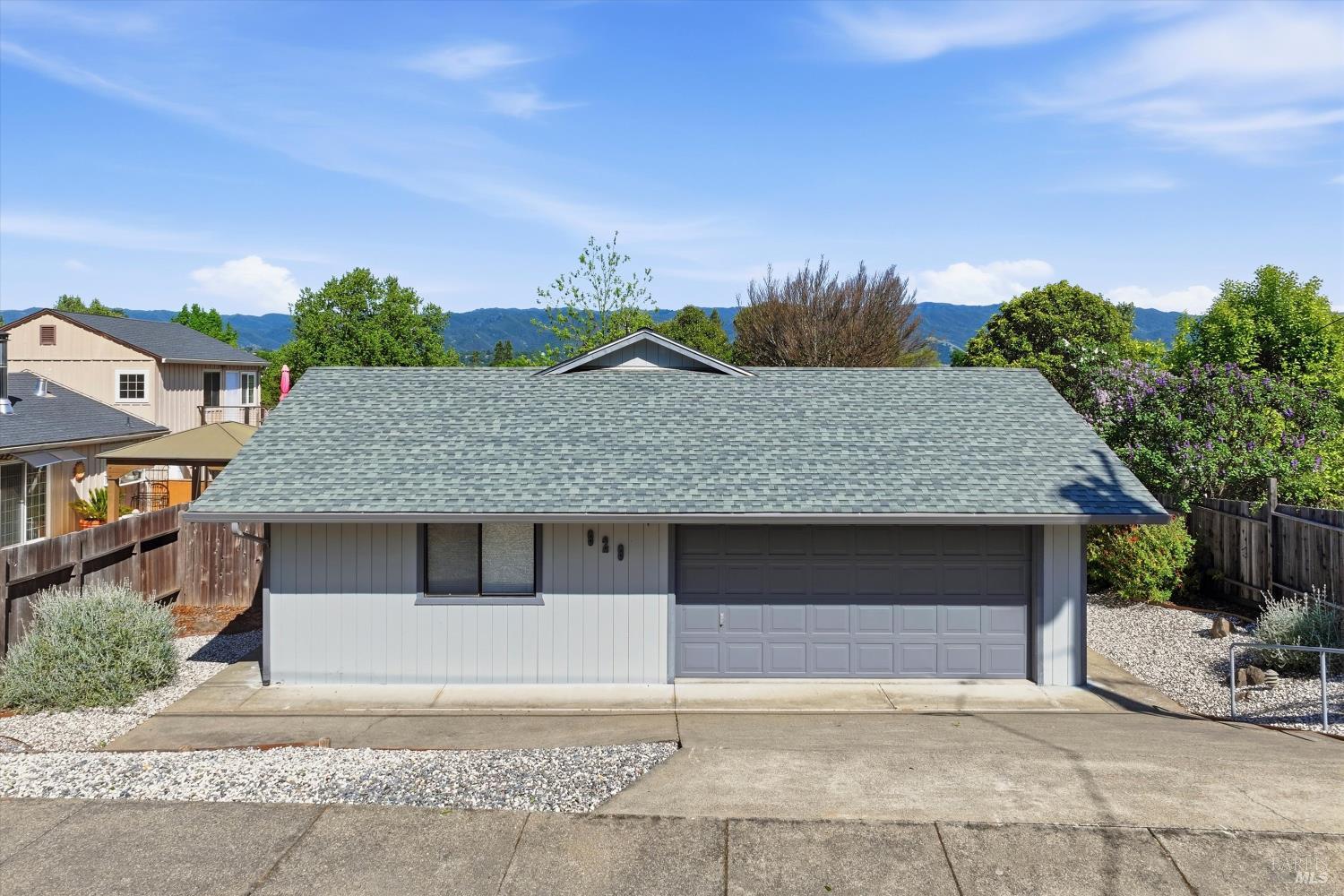 929 Helen Avenue Ukiah, CA 95482 - Photo 28 of 36 a front view of a house with a yard and garage