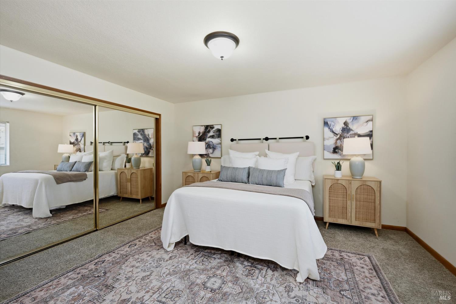 929 Helen Avenue Ukiah, CA 95482 - Photo 10 of 36 a spacious bedroom with a bed and a couch