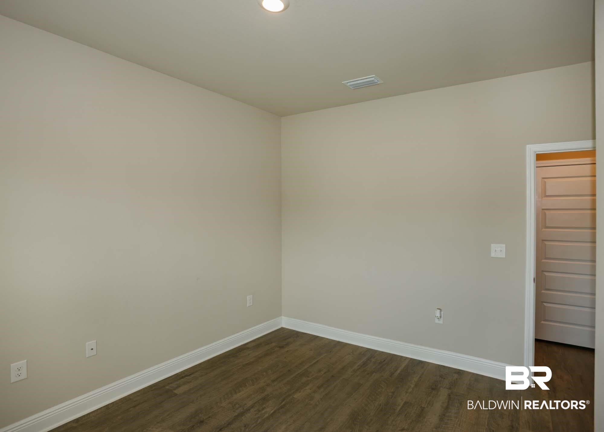 1436 Kairos Loop Foley, AL 36535 - Photo 37 of 52 Unfurnished room with dark wood-style floors and recessed lighting