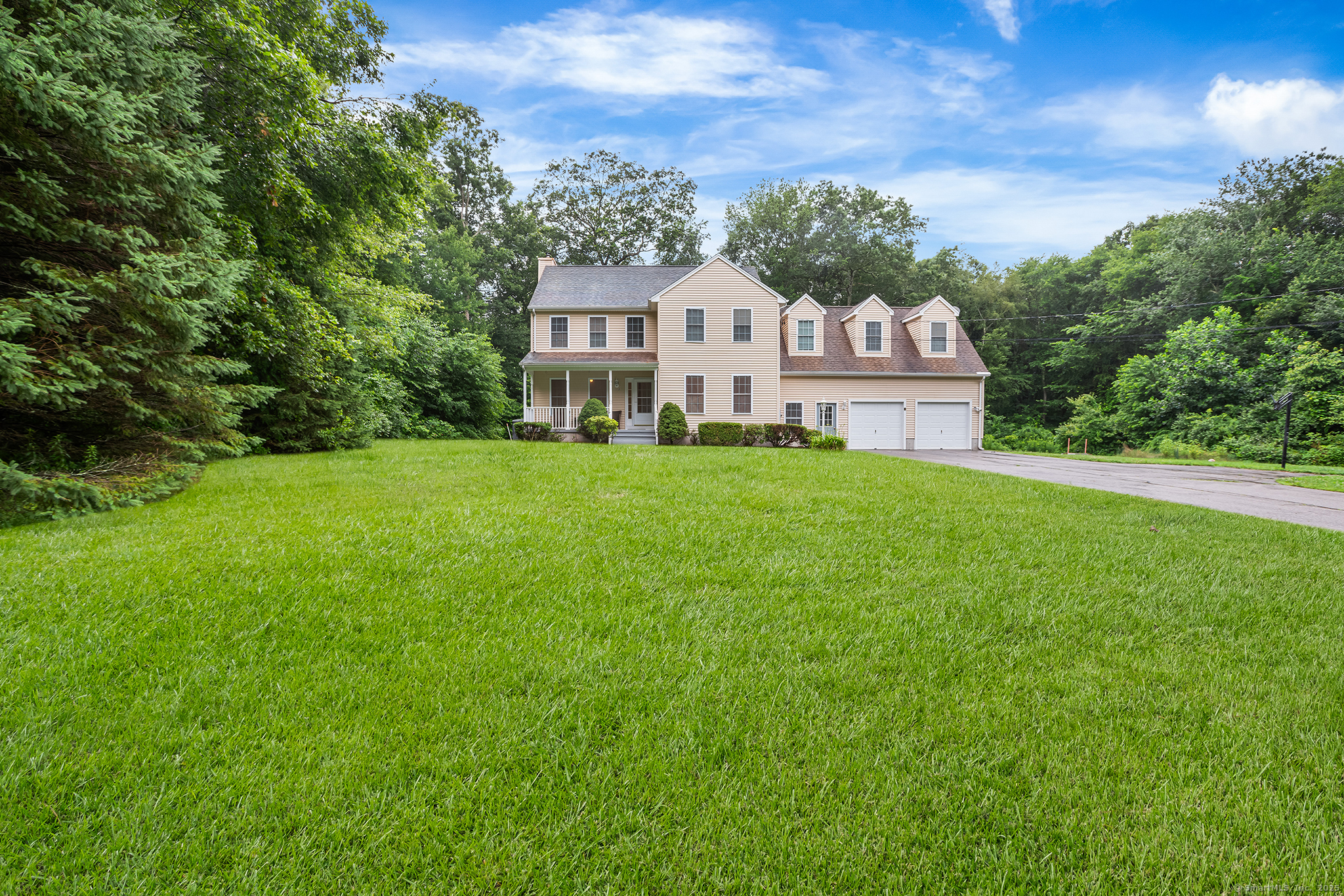 2 Autumn Way Ledyard, CT 06339 - Photo 1 of 1 a view of a white house with a big yard and large trees