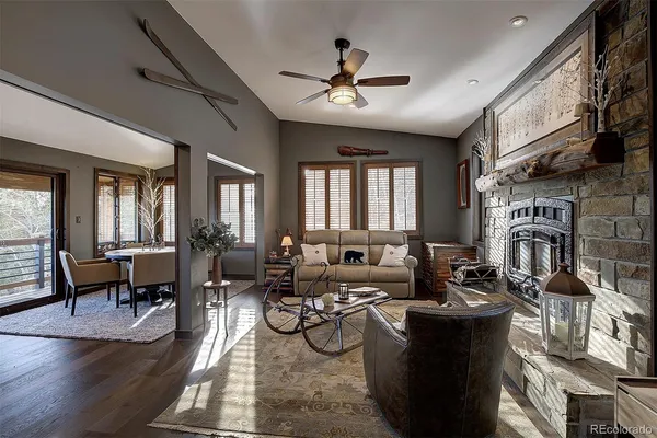 a living room with fireplace furniture and a flat screen tv
