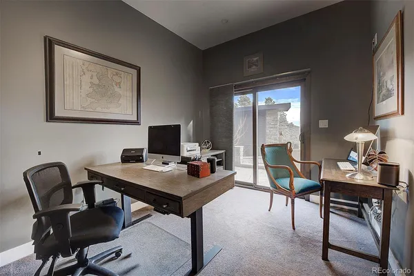 a workspace with furniture and window