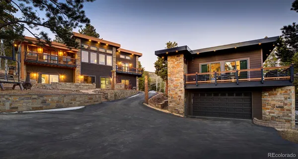 a kitchen with stainless steel appliances granite countertop a stove and a refrigerator