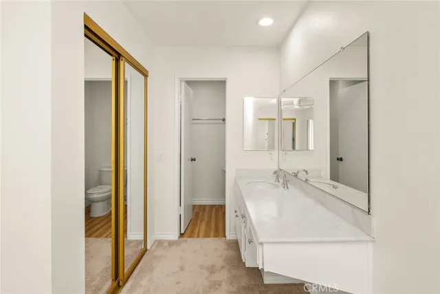 a bathroom with a sink a mirror and a bathtub