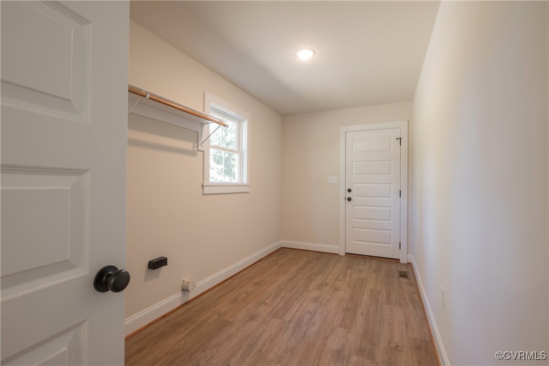 3020 Botone Avenue Richmond, VA 23237 - Photo 18 of 33 an empty room with wooden floor and windows