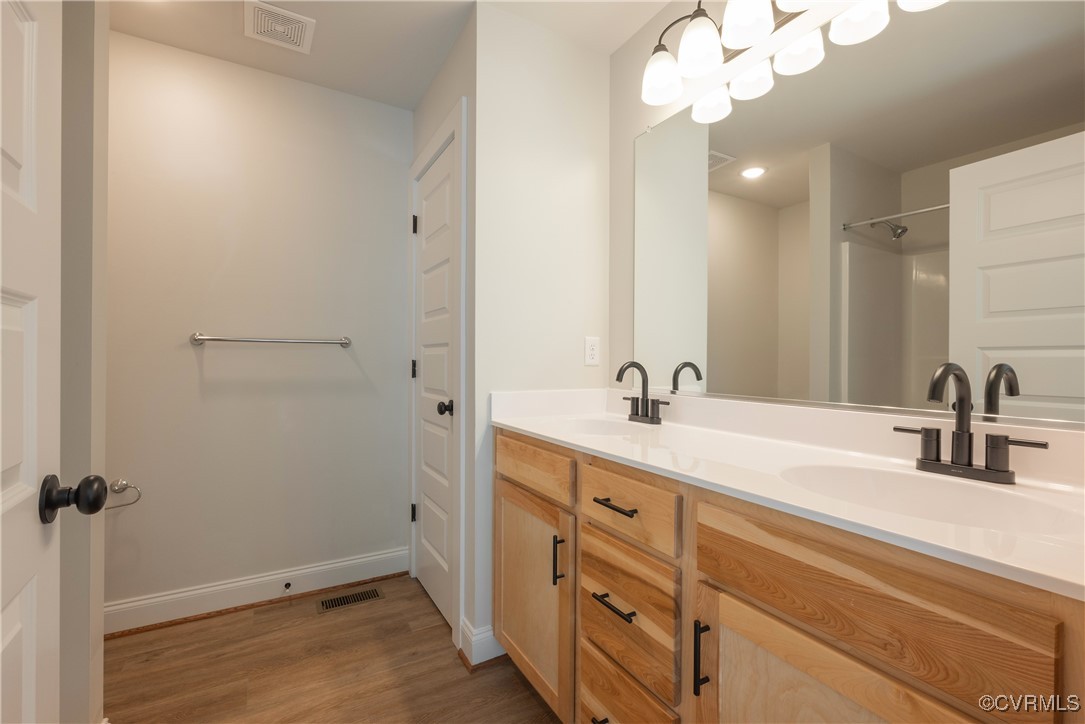 3020 Botone Avenue Richmond, VA 23237 - Photo 25 of 33 a bathroom with a sink vanity and a mirror