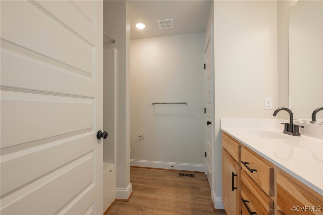 3020 Botone Avenue Richmond, VA 23237 - Photo 26 of 33 a bathroom with a sink and a mirror