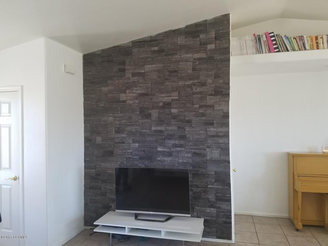 303 Camino Apolena Rio Rico, AZ 85648 - Photo 15 of 15 a living room with a fireplace