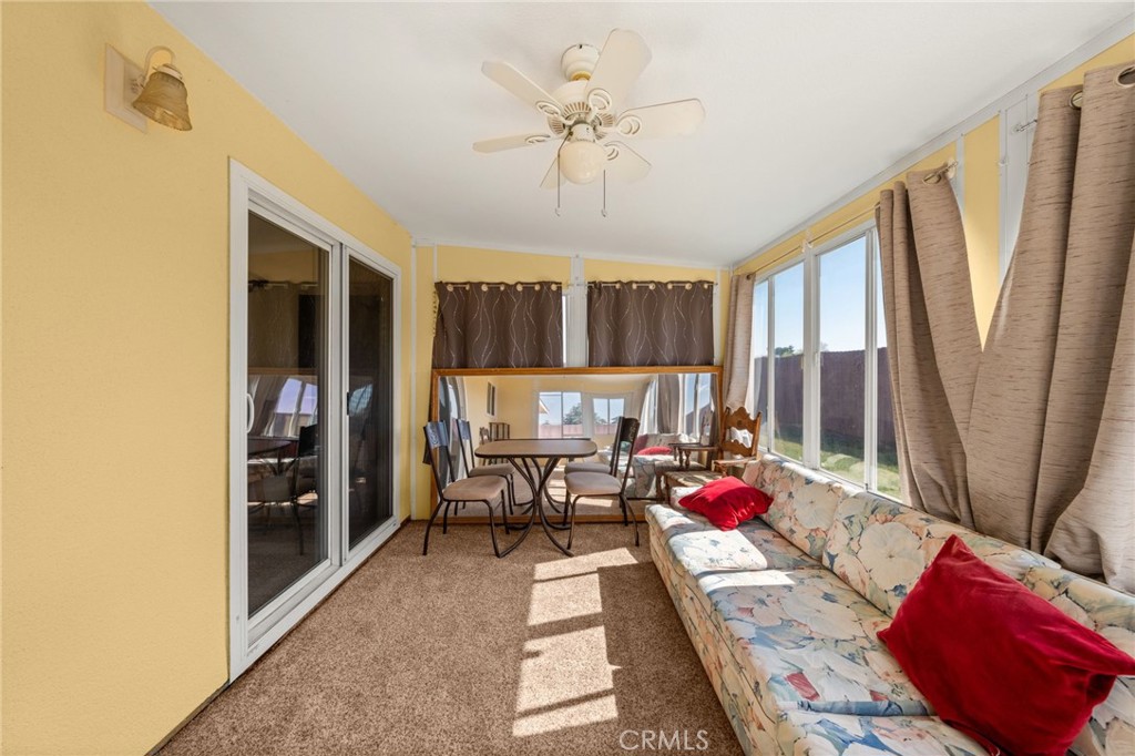 12610 Serrano Drive Yucaipa, CA 92399 - Photo 11 of 29 a living room with furniture and a large window