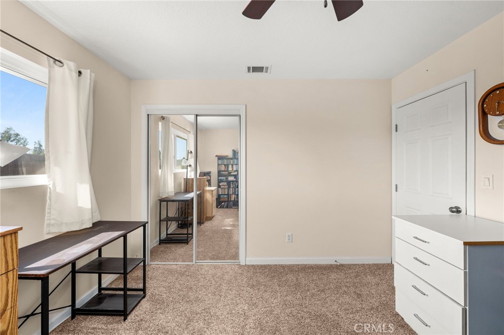 12610 Serrano Drive Yucaipa, CA 92399 - Photo 13 of 29 a view of kitchen with furniture and large window