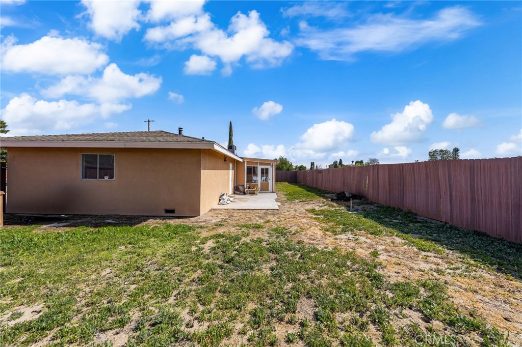 12610 Serrano Drive Yucaipa, CA 92399 - Photo 21 of 29 a backyard of a house with lots of green space