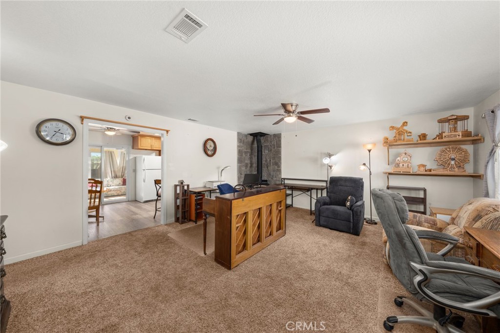 12610 Serrano Drive Yucaipa, CA 92399 - Photo 4 of 29 a living room with furniture and a window