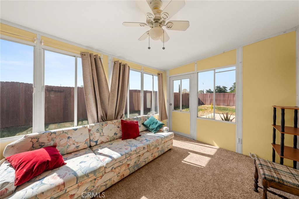 12610 Serrano Drive Yucaipa, CA 92399 - Photo 10 of 29 a bedroom with bed and large window