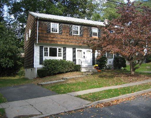 78 Rodgers Road Fairfield, CT 06824 - Photo 1 of 1 a front view of a house with a yard