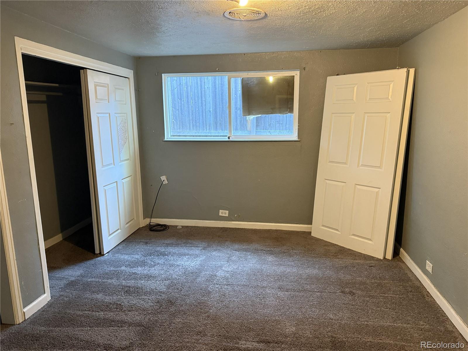 237 South Julian Street Denver, CO 80219 - Photo 4 of 13 an empty room with windows