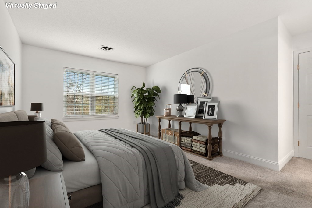 100 Brookside Drive, Unit F Andover, MA 01810 - Photo 12 of 22 a bedroom with a bed and a table in it