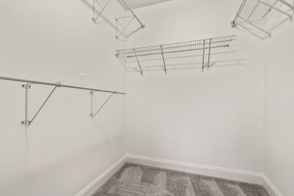 100 Brookside Drive, Unit F Andover, MA 01810 - Photo 16 of 22 a view of a room with racks on the wall