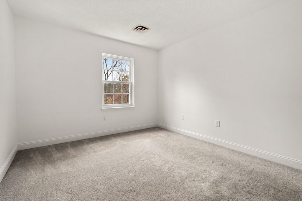 100 Brookside Drive, Unit F Andover, MA 01810 - Photo 17 of 22 a view of an empty room with a window