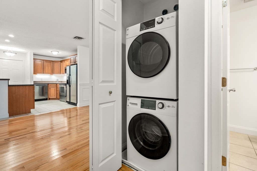100 Brookside Drive, Unit F Andover, MA 01810 - Photo 21 of 22 a view of a hallway with washer and dryer