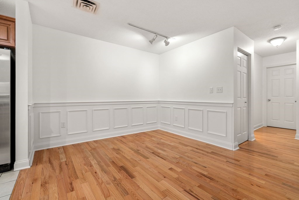 100 Brookside Drive, Unit F Andover, MA 01810 - Photo 8 of 22 wooden floor in an empty room
