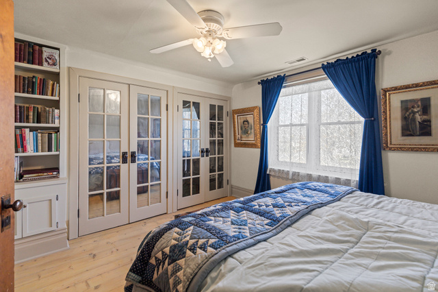 390 North 100 West Monroe, UT 84754 - Photo 81 of 167 Bedroom with light wood finished floors, ceiling fan, and french doors