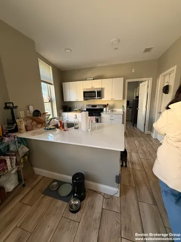 a room with a sink and a mirror