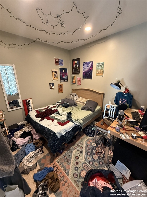10 Roxbury Street, Unit 3 Boston, MA 02119 - Photo 7 of 11 a living room with furniture and a flat screen tv