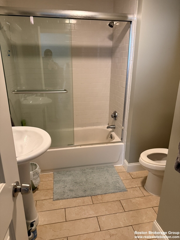 10 Roxbury Street, Unit 3 Boston, MA 02119 - Photo 10 of 11 a bathroom with a toilet and a shower