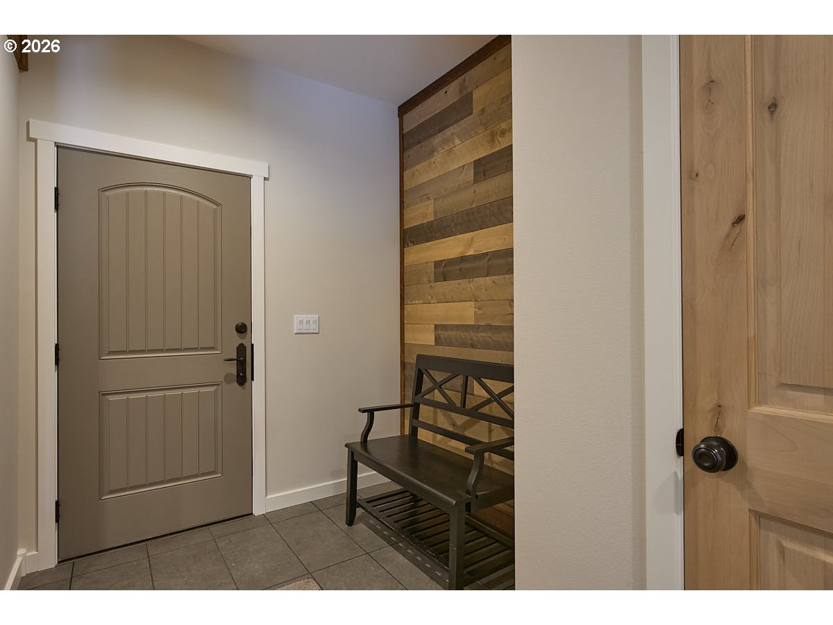 64368 Tamarack Road Lostine, OR 97857 - Photo 13 of 39 a view of a hallway with wooden floor and staircase