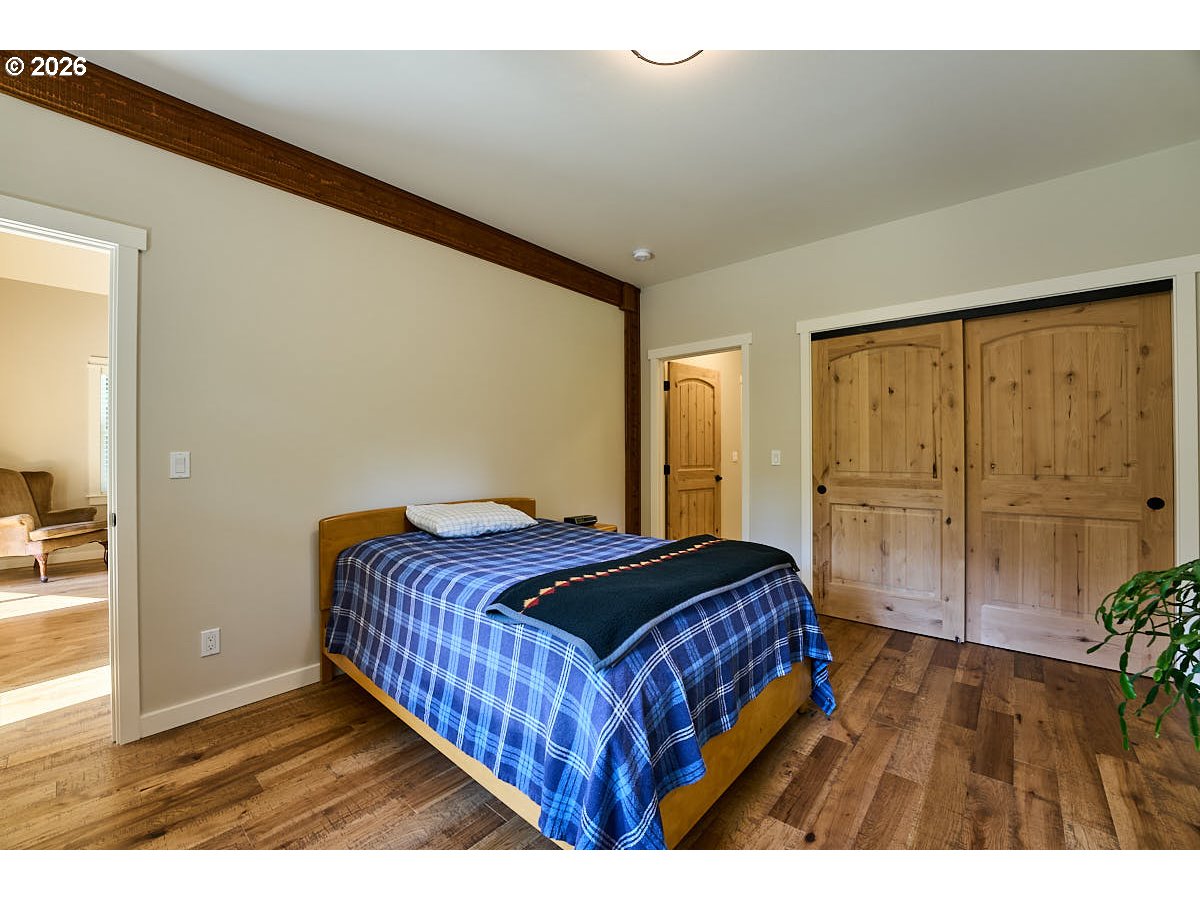 64368 Tamarack Road Lostine, OR 97857 - Photo 15 of 39 a bedroom with a bed and a table