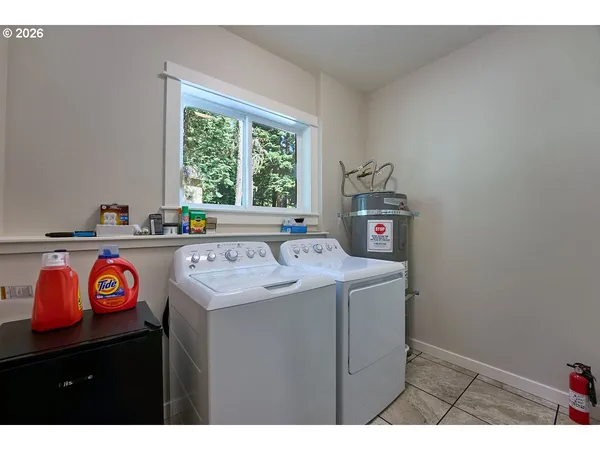 a utility room with washer and dryer