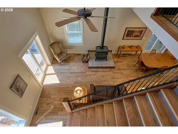 a view of hallway with wooden floor