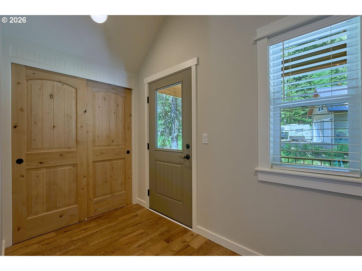 64368 Tamarack Road Lostine, OR 97857 - Photo 25 of 39 a view of an empty room with wooden floor and a window