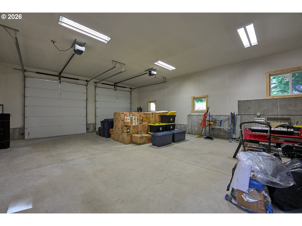 64368 Tamarack Road Lostine, OR 97857 - Photo 30 of 39 a living room with furniture and a flat screen tv