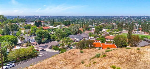 a view of a backyard of the house