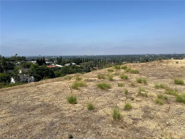 a view of a backyard of a house