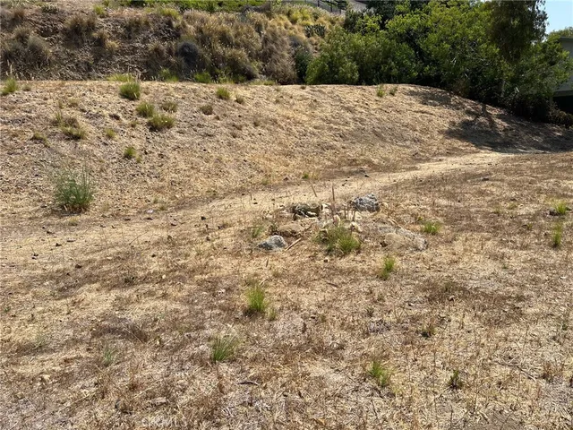 a backyard of a house with wooden fence