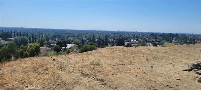 a living room with furniture chandelier and a large window