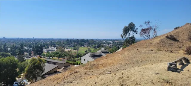 a kitchen with a sink a stove a refrigerator cabinets and a window