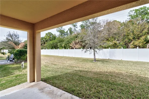 a view of a yard from a balcony