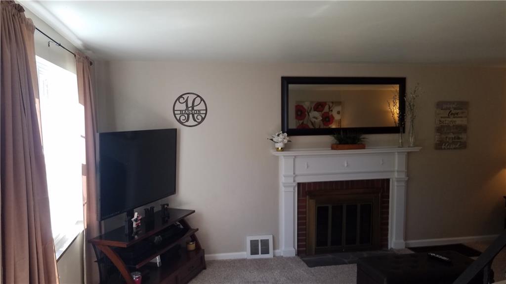 4305 Highgrove Road Pittsburgh, PA 15236 - Photo 8 of 24 Log burning fireplace with gorgeous mantel! Picture window that gives ample lighting!