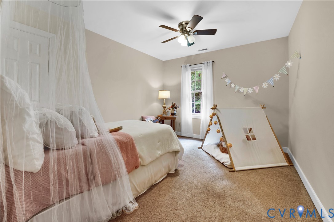 16148 Buckfast Place Beaverdam, VA 23015 - Photo 28 of 48 a bed room with a bed and a chandelier